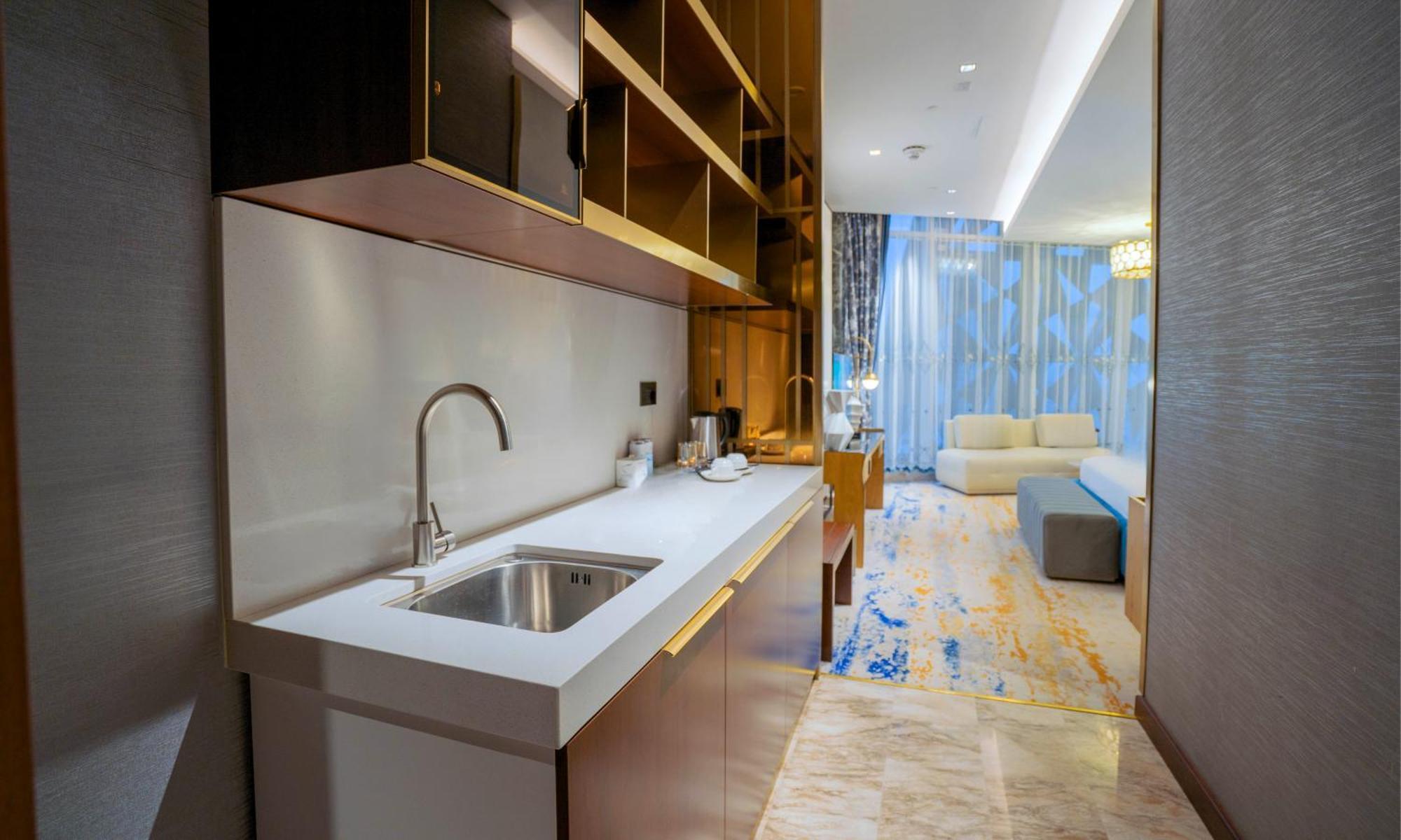 Velero Hotel Doha Lusail Екстериор снимка A kitchen in a hotel suite